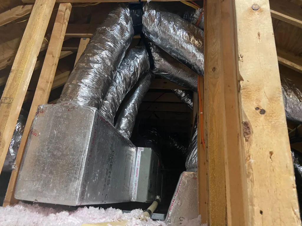 New insulated flex duct and plenum installed in an attic